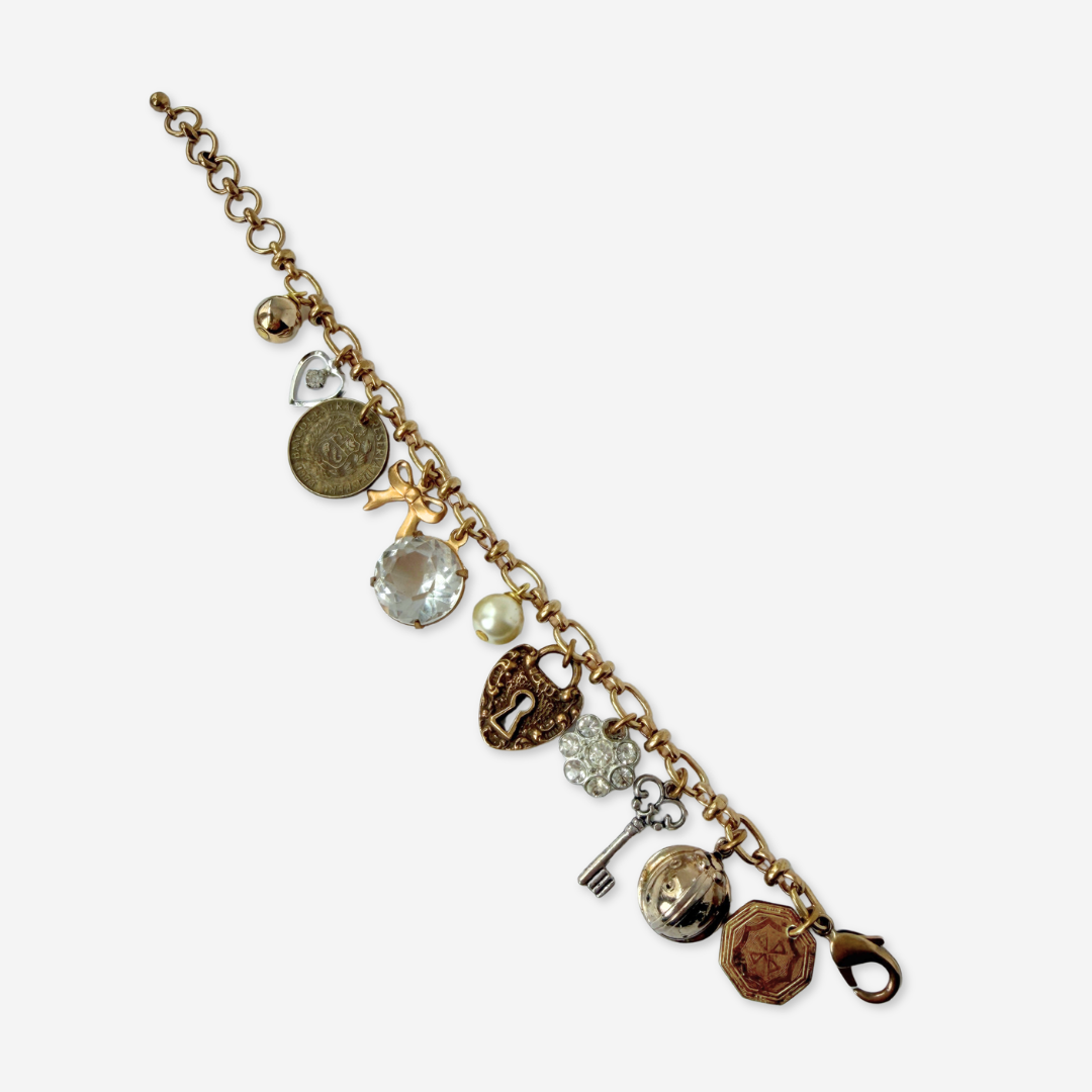 Repurposed vintage mixed neutral charm bracelet